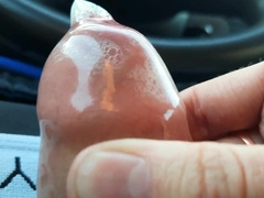 The boy packed the protection to the top with man milk while sitting in the camper