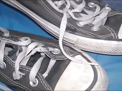 Sneakers with a lot of odor, worn by a young woman.