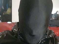 Spandex Hood wearing boy having fun in pvc suit