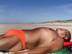 Sunbathing in Fire Island Leopard Orange bikini