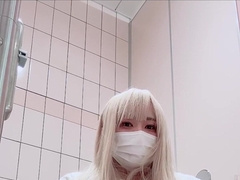 A lady-like fellow strokes in a public toilet