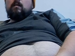 Wild and untamed bear unmasked, showcasing his rugged handsomeness