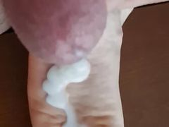 Hard cock slapping and cumshot to wrinkled feet soles