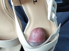 customer white wedge shoes in luggage bag