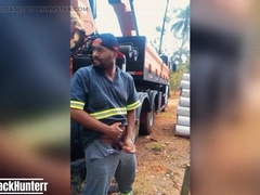 Employee Tugging at the Construction Website Covert Behind the Company Camper