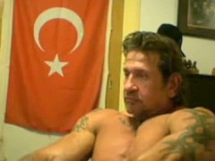 Steamy gay Turkish muscle hunk shows off his muscles
