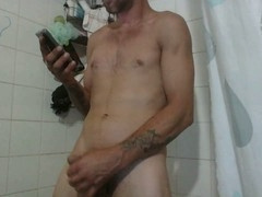 Horny dude showers, jerks off, and indulges in some hot cum eating