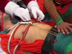 Appealing men play rough Christmas games in bondage perversions
