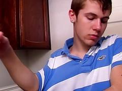 Young man using dildo to masturbate solo