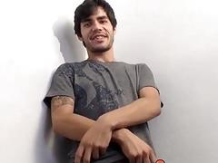 Attractive twink thug strokes his hairy dick and cums solo