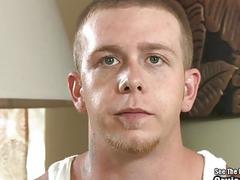 A Fleshlight engulfs this tattooed guy's big boner