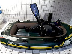 Wetsuit, Fins and Boat - geared pup pawing off