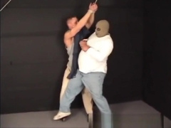 Handsome ex-military stud strung up by hs wrists gagged and stripped.
