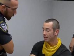 Two gay daddies dominate in muscle police-themed adult film