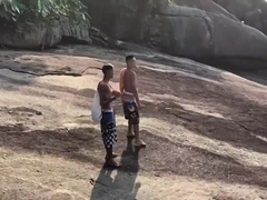 2 BOYS MAKING OUT ON THE BEACH.