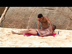 Anal doggy-style on the beach under the sun