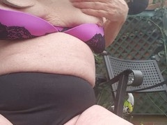 Mature beauty Betty Spanxxx enjoys solo outdoor fun in bra and knickers with her long hair flowing