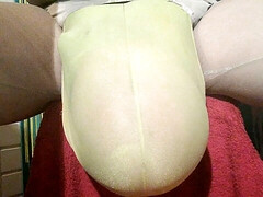 Bulging with filled condom