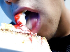 Eating cake with his mouth