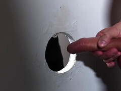 Black lad is sucking and fucking through the glory hole