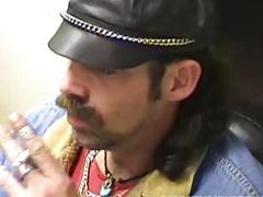 Slender bear with facial hair and lots of rings strokes his meat