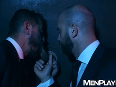 Bruno Max and Thomas Thunder sucking a large dick through a glory hole