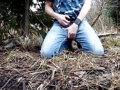 Slave is taking a piss in the woods