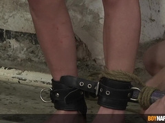 Eyes covered lad Casper Ellis tantalized by Xavier Sibley