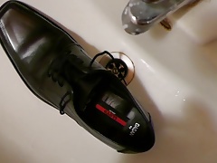 Piss in men's dress shoe