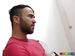 Bearded guy sucking off a black cock at a gloryhole