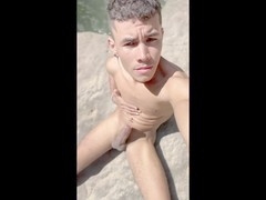 Dark-skinned twink jerking off outside caught on camera
