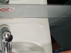Felixproducer strokes his big cock in a public toilet, covering the sink and mirror with a massive load