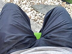 Sitting in the rain wearing Nike nylon pants