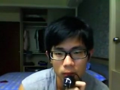 Asian guy in glasses wanks off