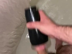 Young fur covered parent plays with flashlight in douche