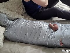 bearded dom using mummified guy as a toy