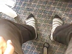 Young African feet out in socks in the office