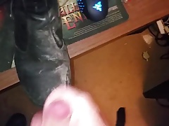 Big cumshot on leather boot