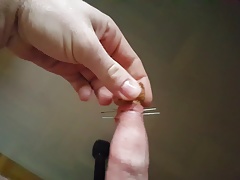 Fisting cock and foreskin with needles