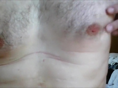 Male nipples saline injection during scrotal infusion play