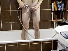 Amateur young man showering himself