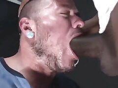 White guy chugs a load from a huge black cock.