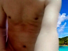 Nude boy on the beach shows his full nude body.