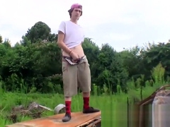 Cute straight guy Sean Johansen works on his dick in nature