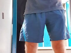 Master Ramon undresses in the dressing room and pisses in the pool shower looking horny in sexy satin shorts