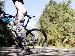 Slim boy with his bike in the park