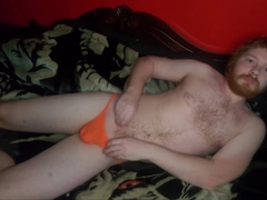 Spunking in orange g-string