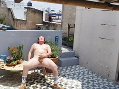 Sandy-haired (ginger) fellow bare taking the sun while drenching and jacking