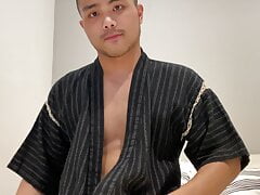 Asian boy in Jinbei stroking