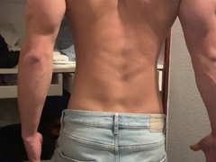 bodybuilder posing in a taut panty